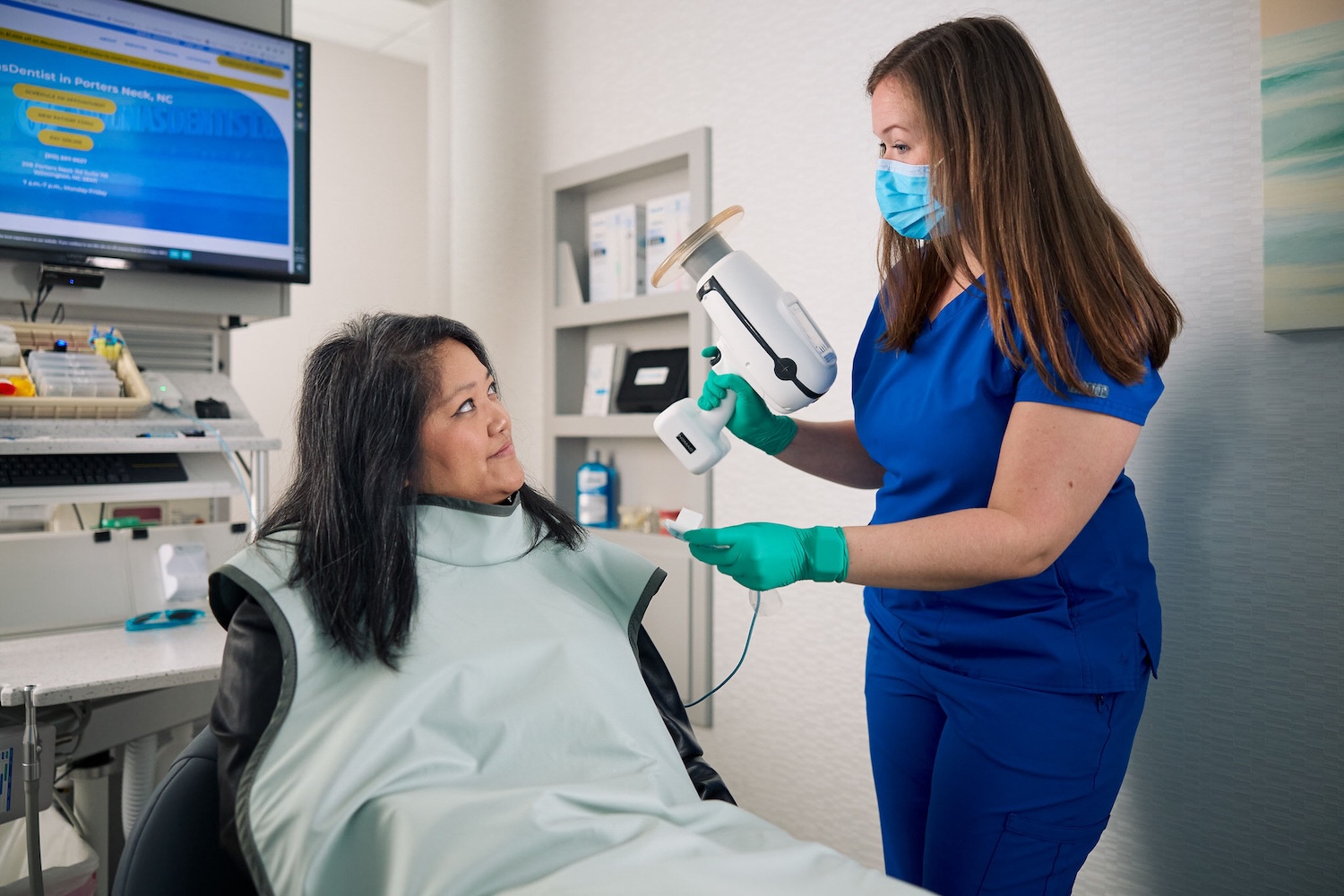 dental assistant recognition week, female dental assistant taking dental X-rays