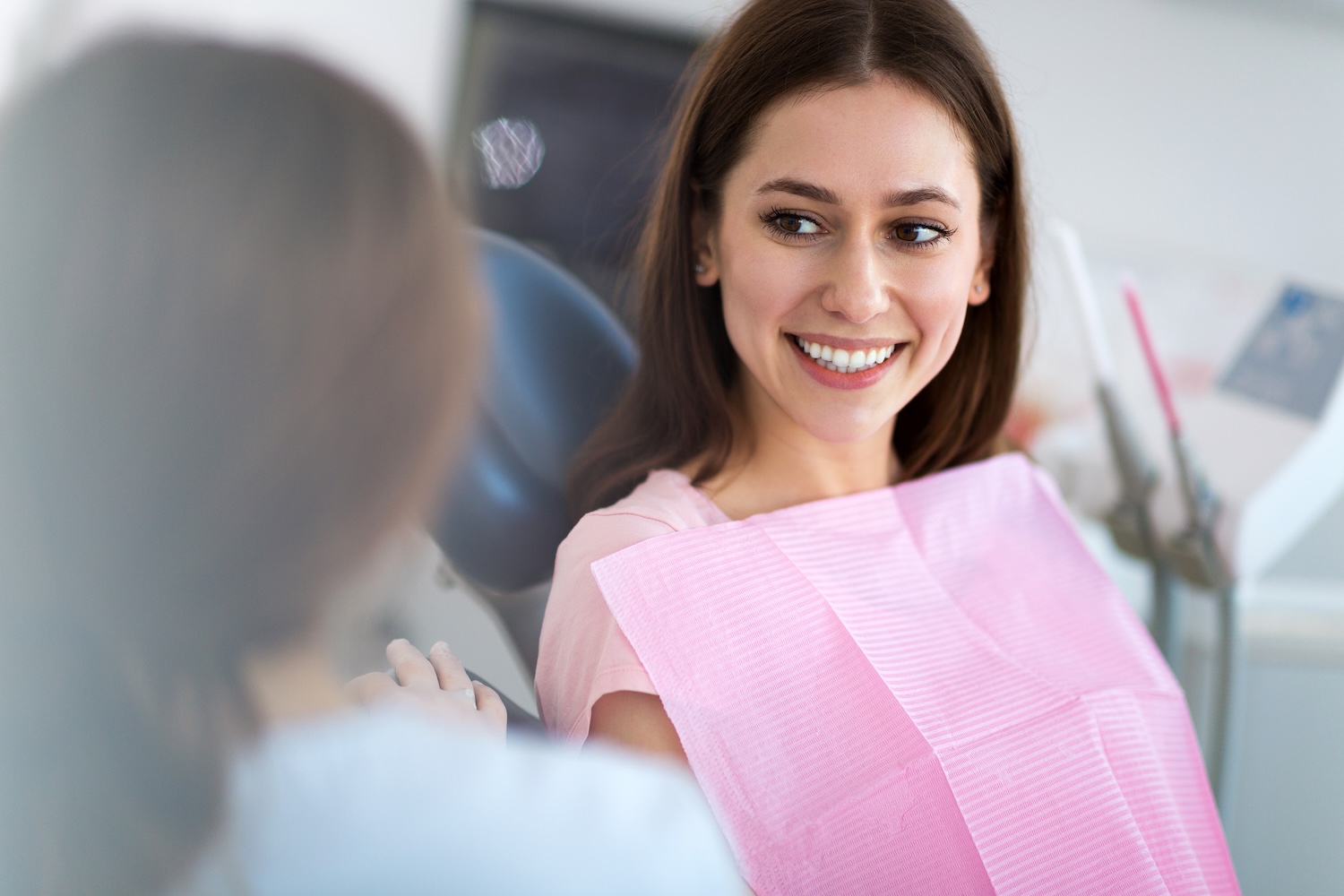 doctor talking to patient about oral hygiene, gingivitis, gum disease awareness month