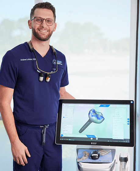 dentist posing with dental tech